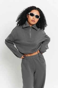 SOLADO Drop Shoulder Top-stitching Cinched Waist Sweater