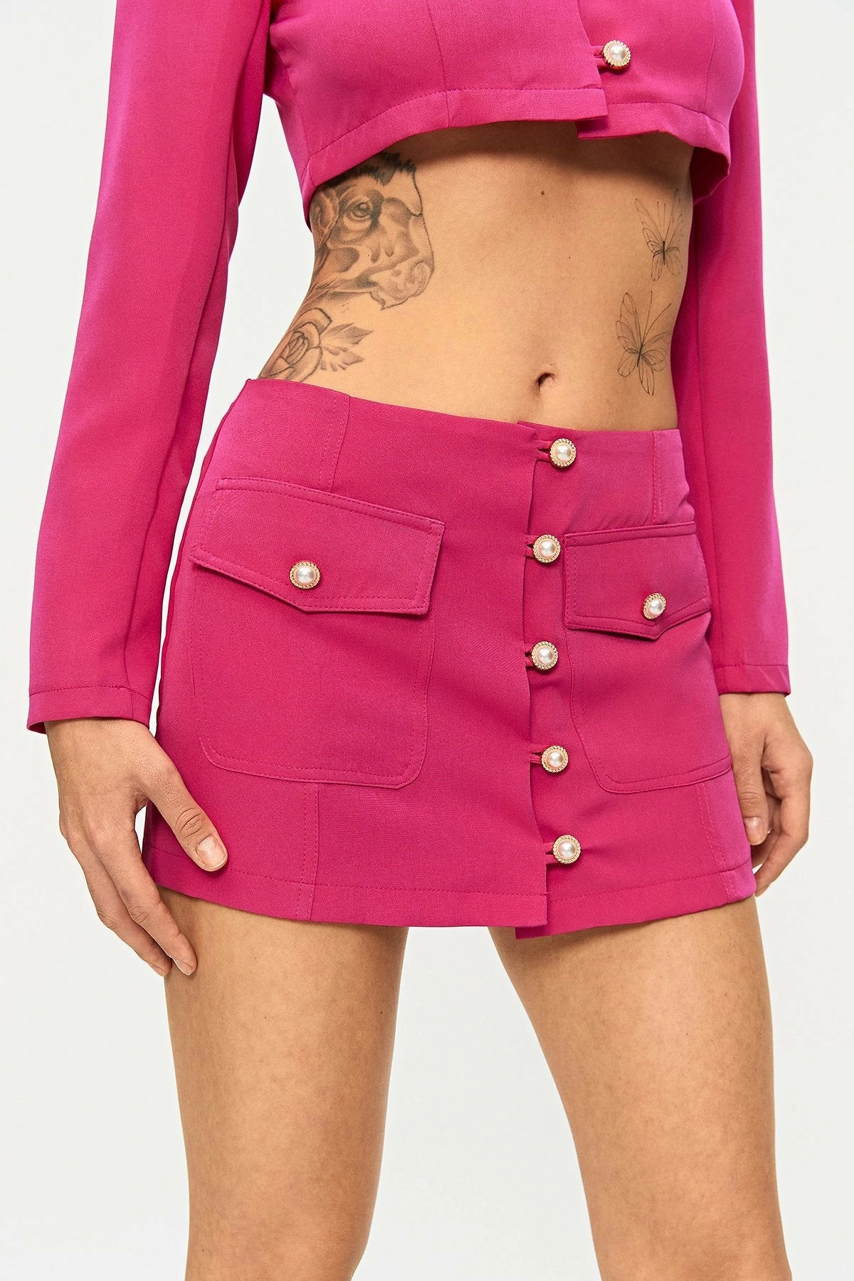 SOLADO Low Waist Button Front Pocket Patched Mini Skirt 2 SOLADO Low Waist Button Front Pocket Patched Mini Skirt - Image 2